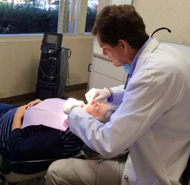 Henderson Dentist Dr. Brian Sanford treating patient